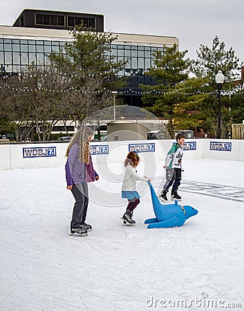 Child Learning to Ice Skate Editorial Stock Photo